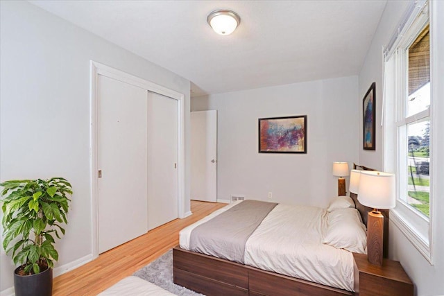 1637 37th Ave NE, Columbia Heights, MN 55421 - bedroom with light wood-style flooring and a closet