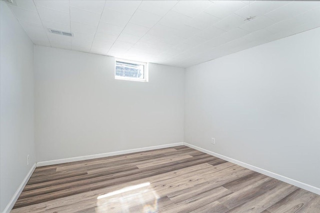 1637 37th Ave NE, Columbia Heights, MN 55421 - unfurnished room with wood finished floors and baseboards