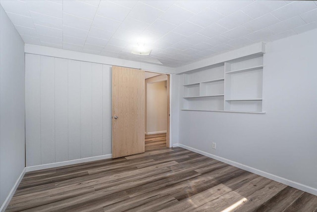 1637 37th Ave NE, Columbia Heights, MN 55421 - unfurnished bedroom featuring wood finished floors and baseboards