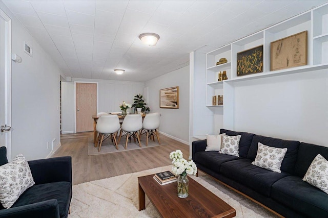 1637 37th Ave NE, Columbia Heights, MN 55421 - living area with wood finished floors, baseboards, and built in shelves