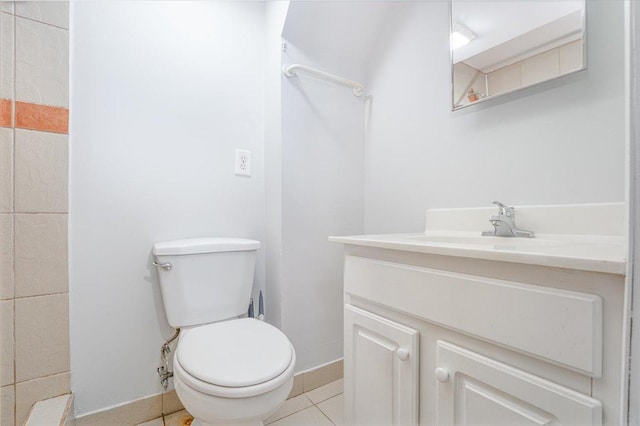1637 37th Ave NE, Columbia Heights, MN 55421 - bathroom featuring vanity, toilet, baseboards, and tile patterned flooring