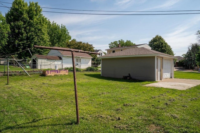 1637 37th Ave NE, Columbia Heights, MN 55421 - view of yard with a detached garage and an outbuilding