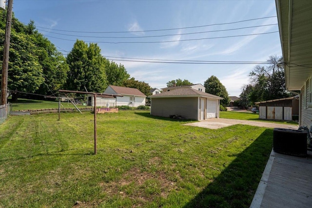 1637 37th Ave NE, Columbia Heights, MN 55421 - view of yard with an outbuilding, a detached garage, and central AC