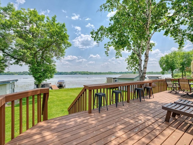 46427 Cambridge Dr, Stanchfield, MN 55080 - wooden terrace featuring a water view, a lawn, and outdoor dining area