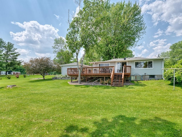 46427 Cambridge Dr, Stanchfield, MN 55080 - back of property featuring a deck, a yard, and stairs