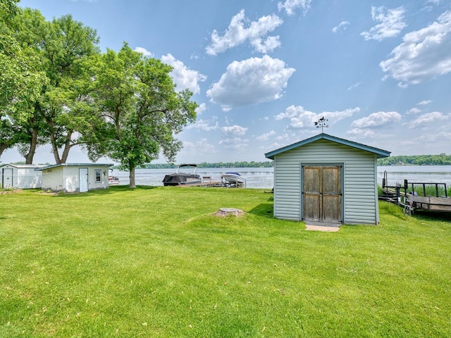 46427 Cambridge Dr, Stanchfield, MN 55080 - view of green lawn with a water view