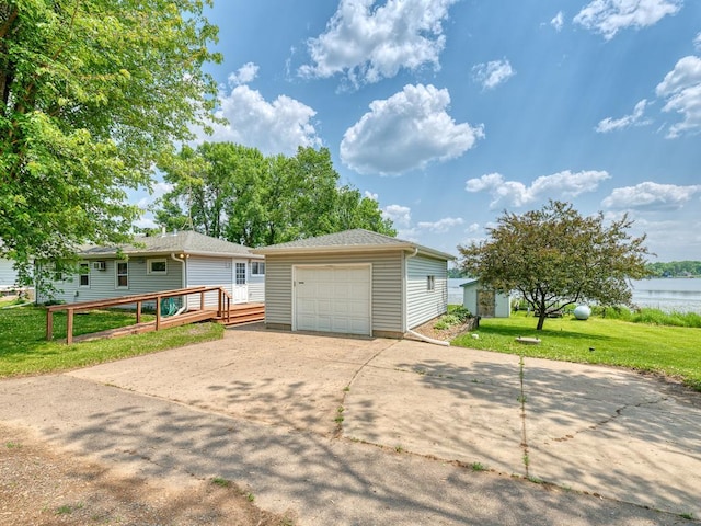46427 Cambridge Dr, Stanchfield, MN 55080 - view of front of home featuring an outbuilding, concrete driveway, a garage, a front yard, and a deck