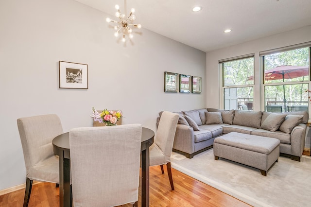 560 2nd St Unit 114, Minneapolis, MN 55401 - living area featuring a chandelier, light wood finished floors, recessed lighting, vaulted ceiling, and baseboards