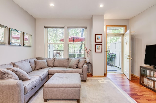 560 2nd St Unit 114, Minneapolis, MN 55401 - living room with plenty of natural light, recessed lighting, baseboards, and light wood-style floors
