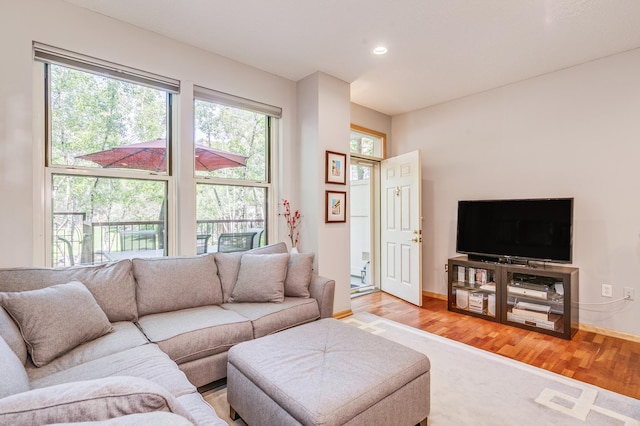 560 2nd St Unit 114, Minneapolis, MN 55401 - living room featuring light wood-style floors, recessed lighting, and baseboards