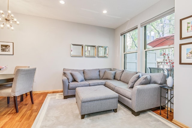 560 2nd St Unit 114, Minneapolis, MN 55401 - living room with a chandelier, light wood finished floors, recessed lighting, and baseboards