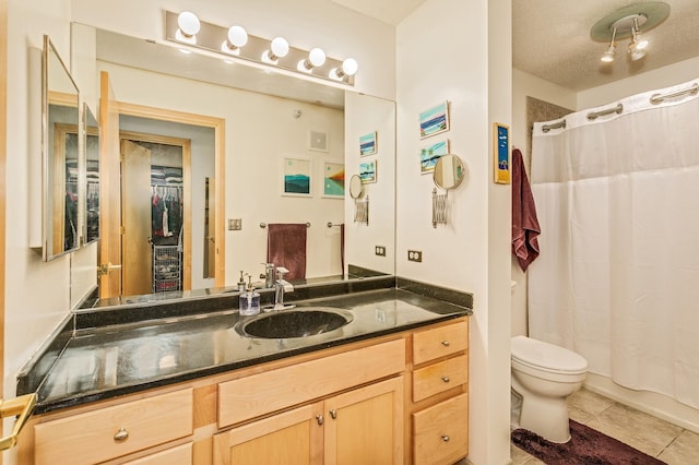 560 2nd St Unit 114, Minneapolis, MN 55401 - bathroom with toilet, tile patterned flooring, vanity, and a shower with shower curtain