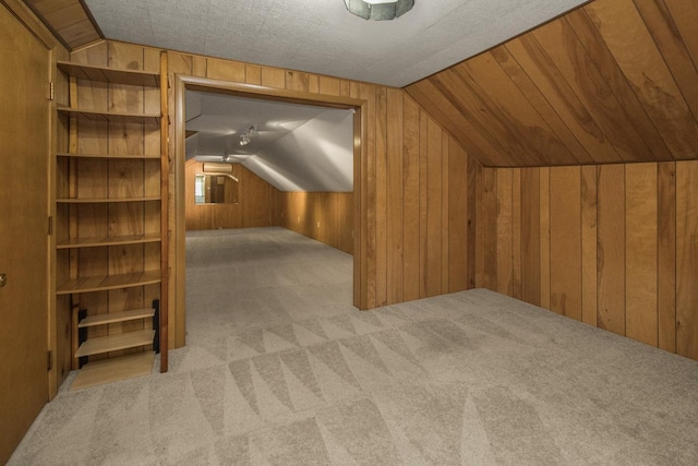 1700 Case Ave E, Saint Paul, MN 55106 - additional living space with vaulted ceiling, carpet flooring, and wood walls