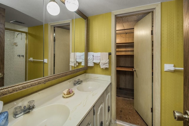 1700 Case Ave E, Saint Paul, MN 55106 - full bathroom featuring double vanity and a stall shower