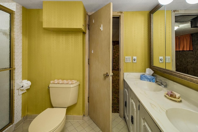 1700 Case Ave E, Saint Paul, MN 55106 - bathroom with double vanity, a shower stall, and toilet