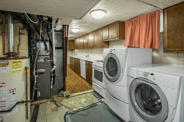 1700 Case Ave E, Saint Paul, MN 55106 - washroom with gas water heater, washer and dryer, cabinet space, and tile patterned floors