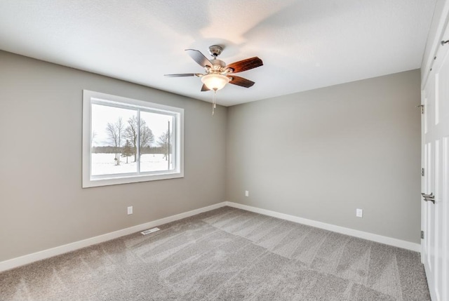 4781 261st St, Wyoming, MN 55092 - unfurnished room with a ceiling fan, baseboards, and carpet flooring