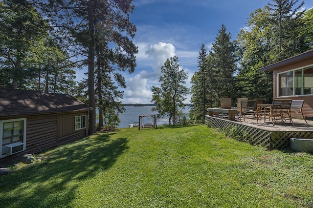 1409 Wabedo Pass Rd NE, Longville, MN 56655 - view of grassy yard featuring a deck with water view