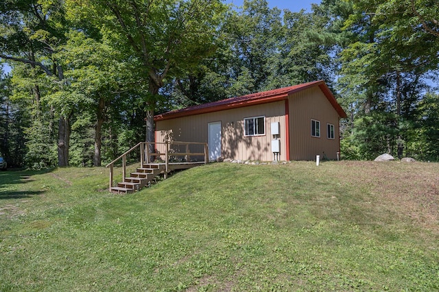 1409 Wabedo Pass Rd NE, Longville, MN 56655 - exterior space featuring a front lawn and a deck