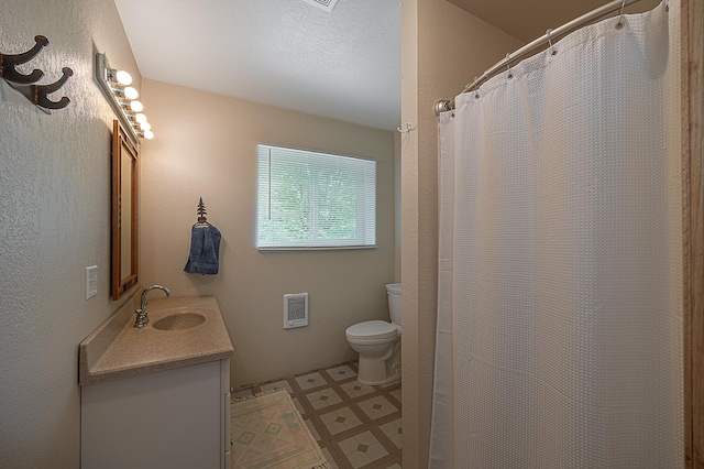 1409 Wabedo Pass Rd NE, Longville, MN 56655 - bathroom with tile patterned floors, vanity, toilet, heating unit, and a shower with shower curtain