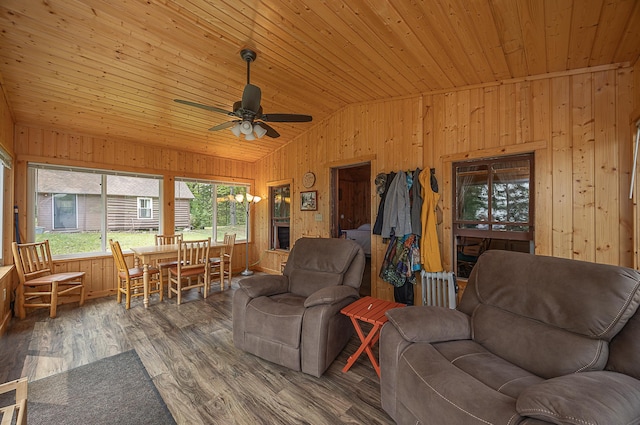 1409 Wabedo Pass Rd NE, Longville, MN 56655 - living room with wooden walls, lofted ceiling, ceiling fan, wood ceiling, and wood finished floors