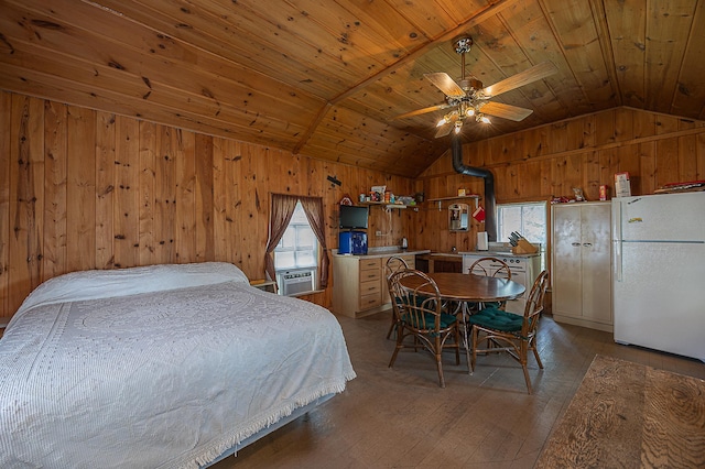 1409 Wabedo Pass Rd NE, Longville, MN 56655 - bedroom with freestanding refrigerator, lofted ceiling, wood walls, light wood-style floors, and wooden ceiling