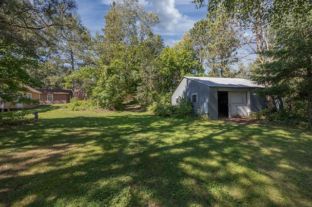 1409 Wabedo Pass Rd NE, Longville, MN 56655 - view of grassy yard featuring an outdoor structure and a pole building