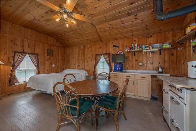 1409 Wabedo Pass Rd NE, Longville, MN 56655 - dining area with lofted ceiling, dark wood-style floors, wooden walls, wood ceiling, and ceiling fan