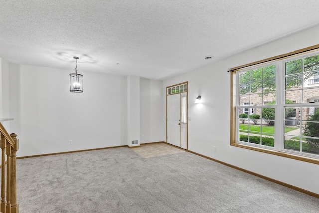 15481 Frost Path Unit 1803, Apple Valley, MN 55124 - spare room with a textured ceiling, light colored carpet, healthy amount of natural light, and a chandelier