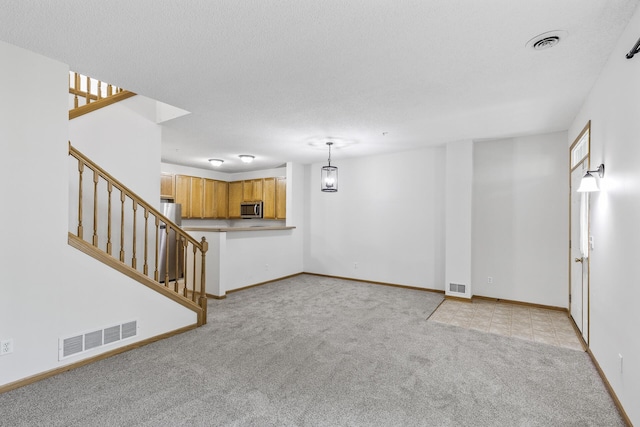 15481 Frost Path Unit 1803, Apple Valley, MN 55124 - unfurnished living room with light carpet and stairway
