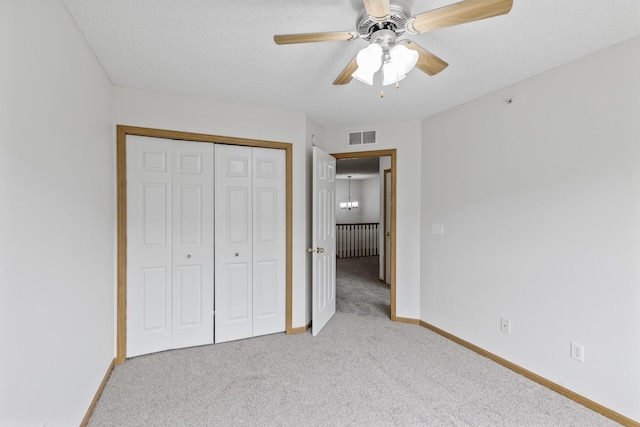 15481 Frost Path Unit 1803, Apple Valley, MN 55124 - unfurnished bedroom featuring light colored carpet, a closet, ceiling fan, and a textured ceiling