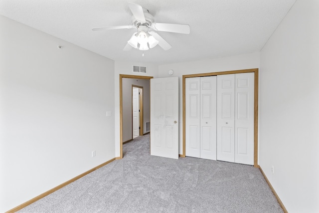 15481 Frost Path Unit 1803, Apple Valley, MN 55124 - unfurnished bedroom with carpet floors, ceiling fan, a closet, and a textured ceiling