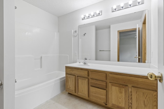 15481 Frost Path Unit 1803, Apple Valley, MN 55124 - full bath with vanity, a textured ceiling, and bathtub / shower combination