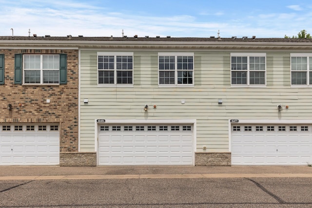 15481 Frost Path Unit 1803, Apple Valley, MN 55124 - view of front of home featuring a garage and brick siding
