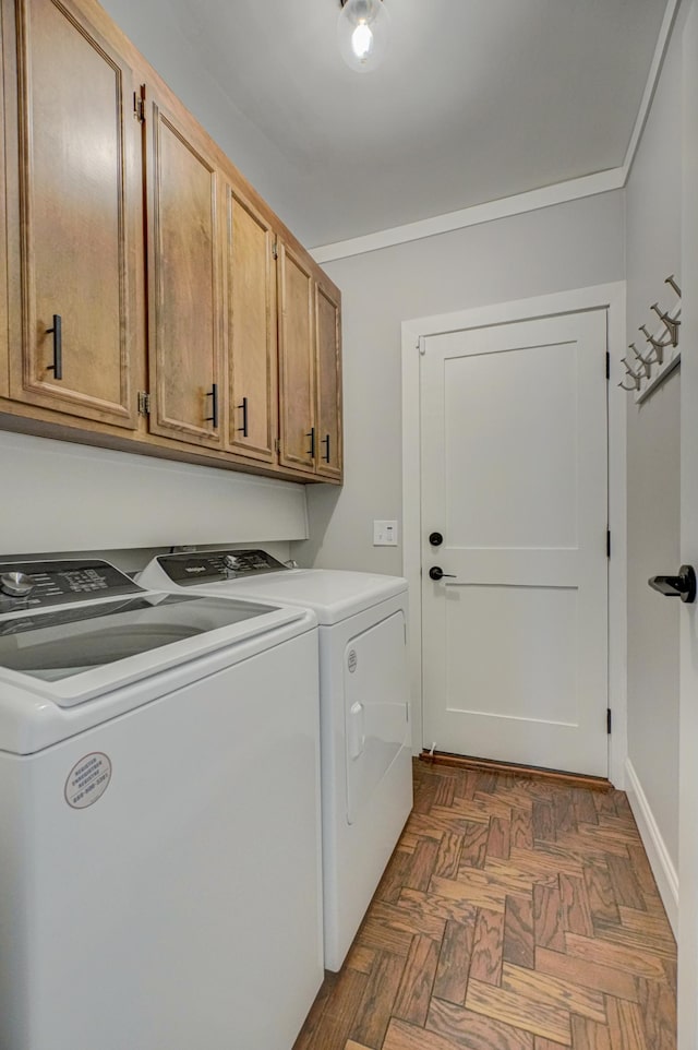 8517 143rd St W, Apple Valley, MN 55124 - laundry area with washer and clothes dryer, cabinet space, and crown molding
