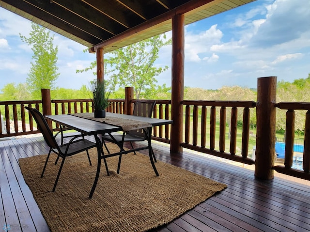 25712 15th Ave N, Highland Grove Twp, MN 56549 - wooden deck featuring outdoor dining space