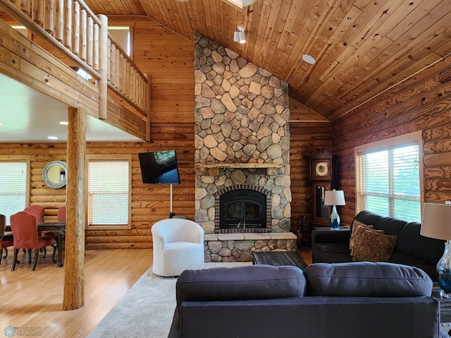 25712 15th Ave N, Highland Grove Twp, MN 56549 - living area featuring high vaulted ceiling, wood finished floors, a stone fireplace, wooden ceiling, and recessed lighting