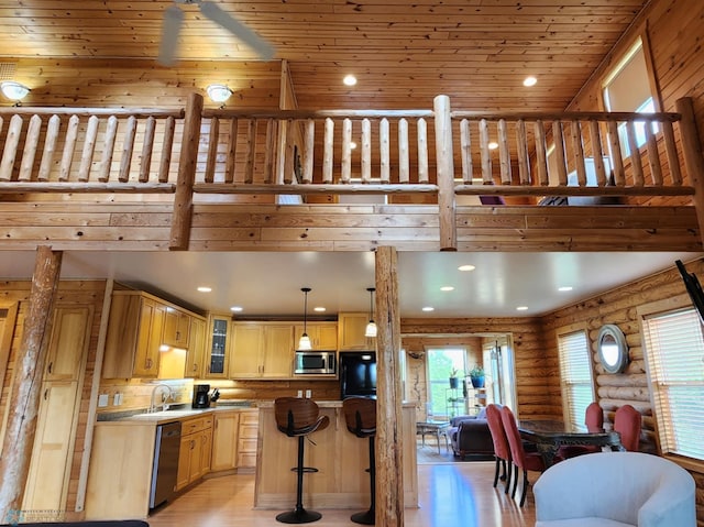 25712 15th Ave N, Highland Grove Twp, MN 56549 - kitchen featuring stainless steel appliances, rustic walls, light brown cabinets, light wood finished floors, and glass insert cabinets