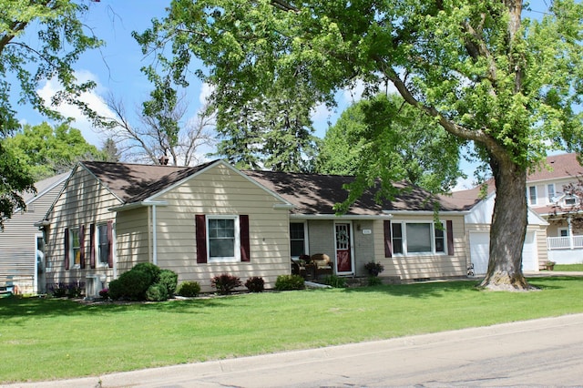 606 Center Ave N, Blooming Prairie, MN 55917 - ranch-style house with an attached garage and a front lawn
