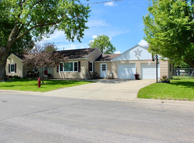 606 Center Ave N, Blooming Prairie, MN 55917 - single story home with an attached garage, driveway, and a front lawn