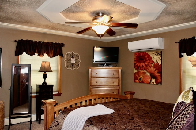 606 Center Ave N, Blooming Prairie, MN 55917 - carpeted bedroom with an AC wall unit, a textured ceiling, and a ceiling fan