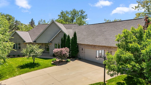 600 Sibley Ct, Mendota Heights, MN 55118 - view of front of home featuring brick siding, concrete driveway, a garage, and a front lawn