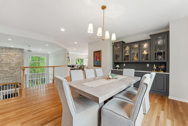 600 Sibley Ct, Mendota Heights, MN 55118 - dining room featuring light wood-type flooring, a ceiling fan, recessed lighting, a chandelier, and baseboards