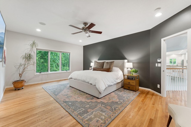 600 Sibley Ct, Mendota Heights, MN 55118 - bedroom with light wood-style flooring, baseboards, recessed lighting, and ceiling fan