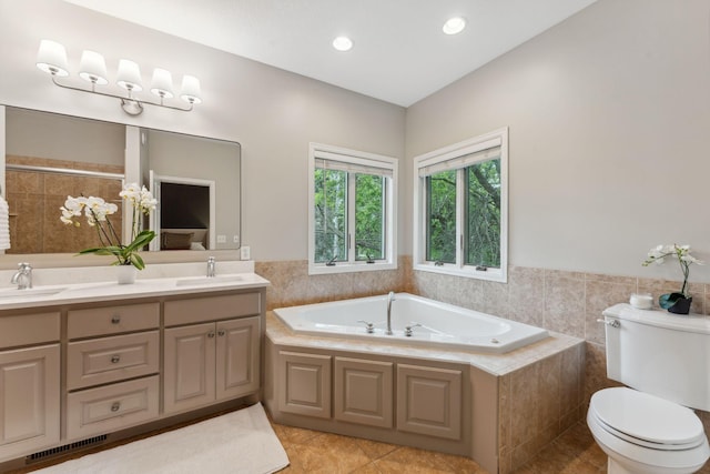 600 Sibley Ct, Mendota Heights, MN 55118 - full bath featuring tile patterned floors, a bath, double vanity, and toilet