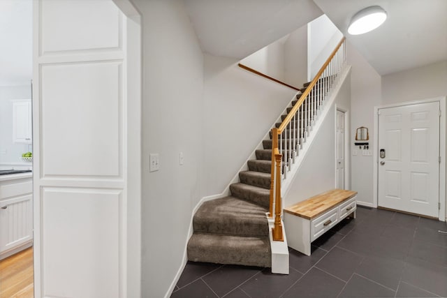 600 Sibley Ct, Mendota Heights, MN 55118 - entryway with stairway, dark tile patterned flooring, and baseboards