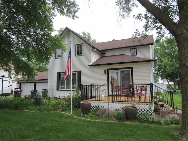 909 6th Ave, Brewster, MN 56119 - back of house featuring roof with shingles, a wooden deck, a lawn, and a garage