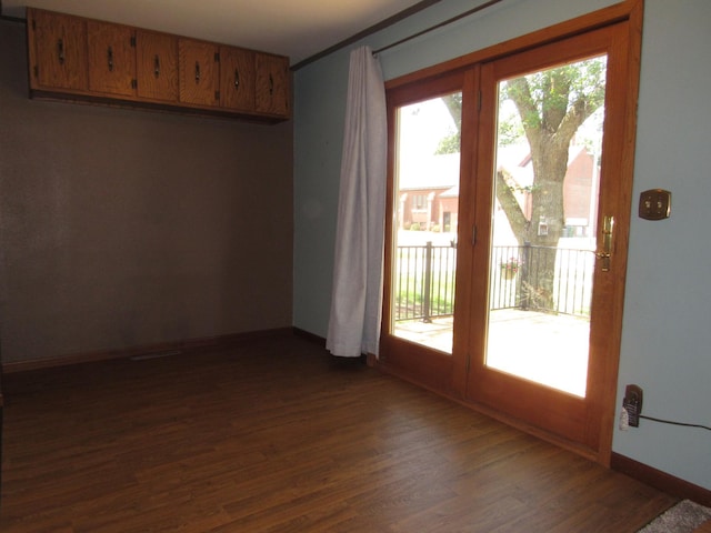 909 6th Ave, Brewster, MN 56119 - spare room with dark wood-style floors and french doors
