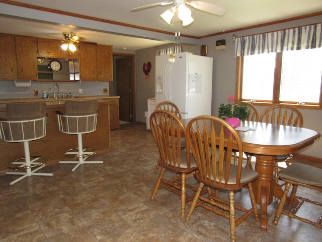 909 6th Ave, Brewster, MN 56119 - dining space featuring a ceiling fan and ornamental molding