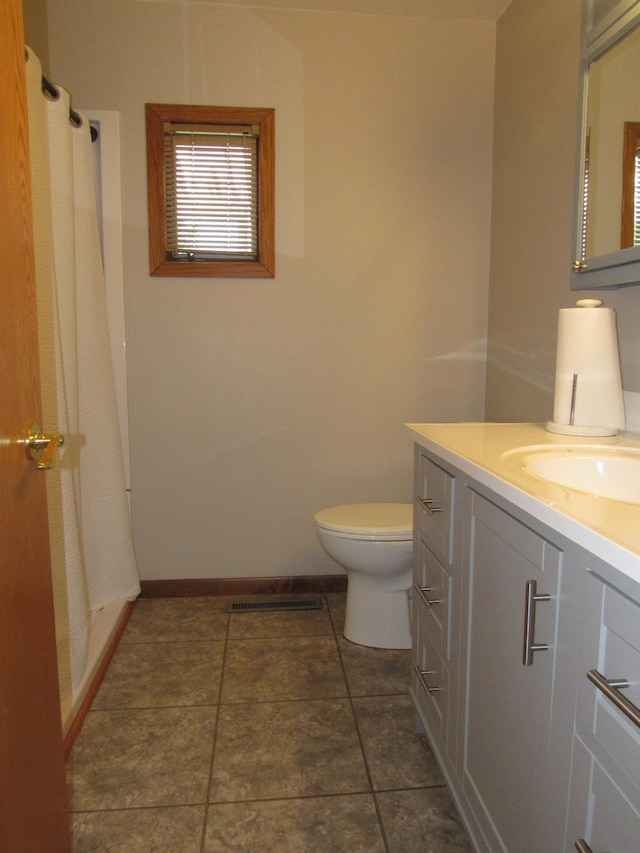 909 6th Ave, Brewster, MN 56119 - bathroom featuring vanity, tile patterned flooring, and curtained shower
